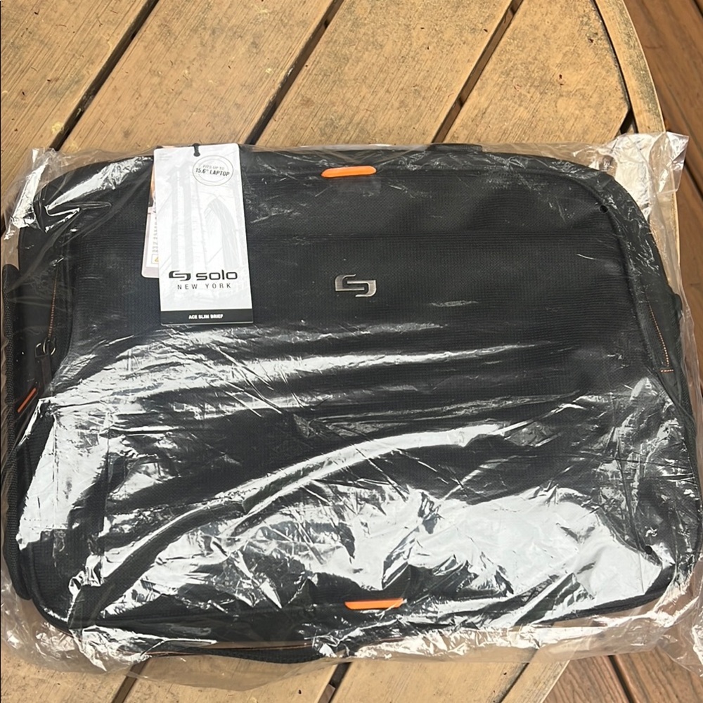 Solo Black and Orange Laptop Bag Professional Design